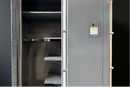 Gun safe with an open door against black background 