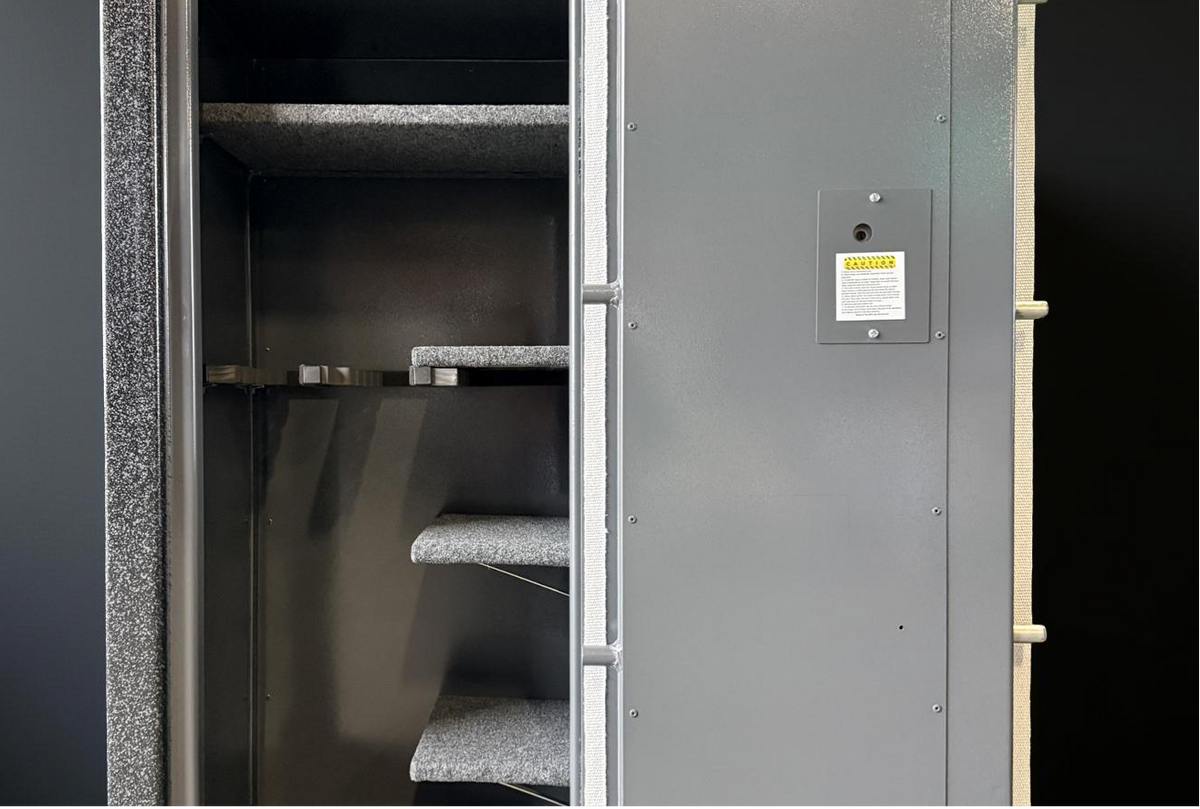 Gun safe with an open door against black background 