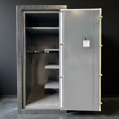 Gun safe with an open door against black background 