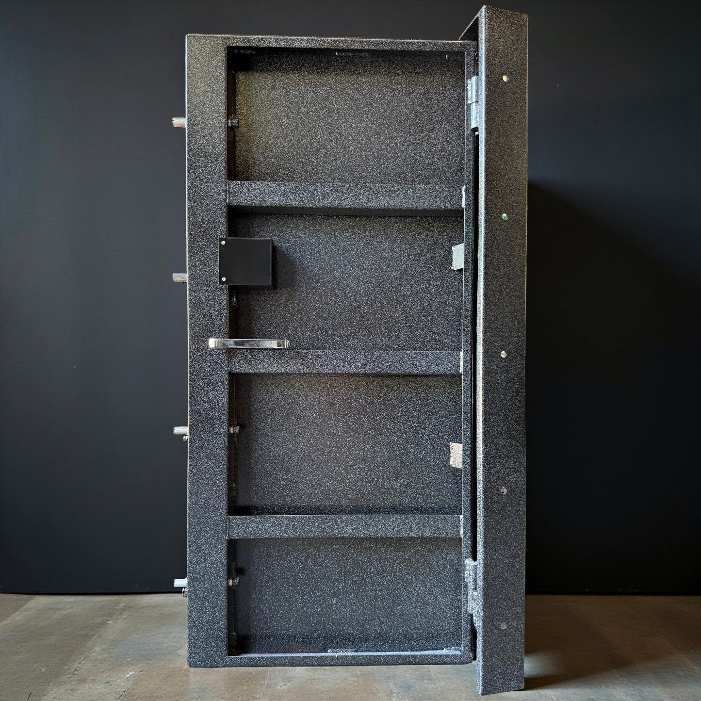 back of vault door with black background