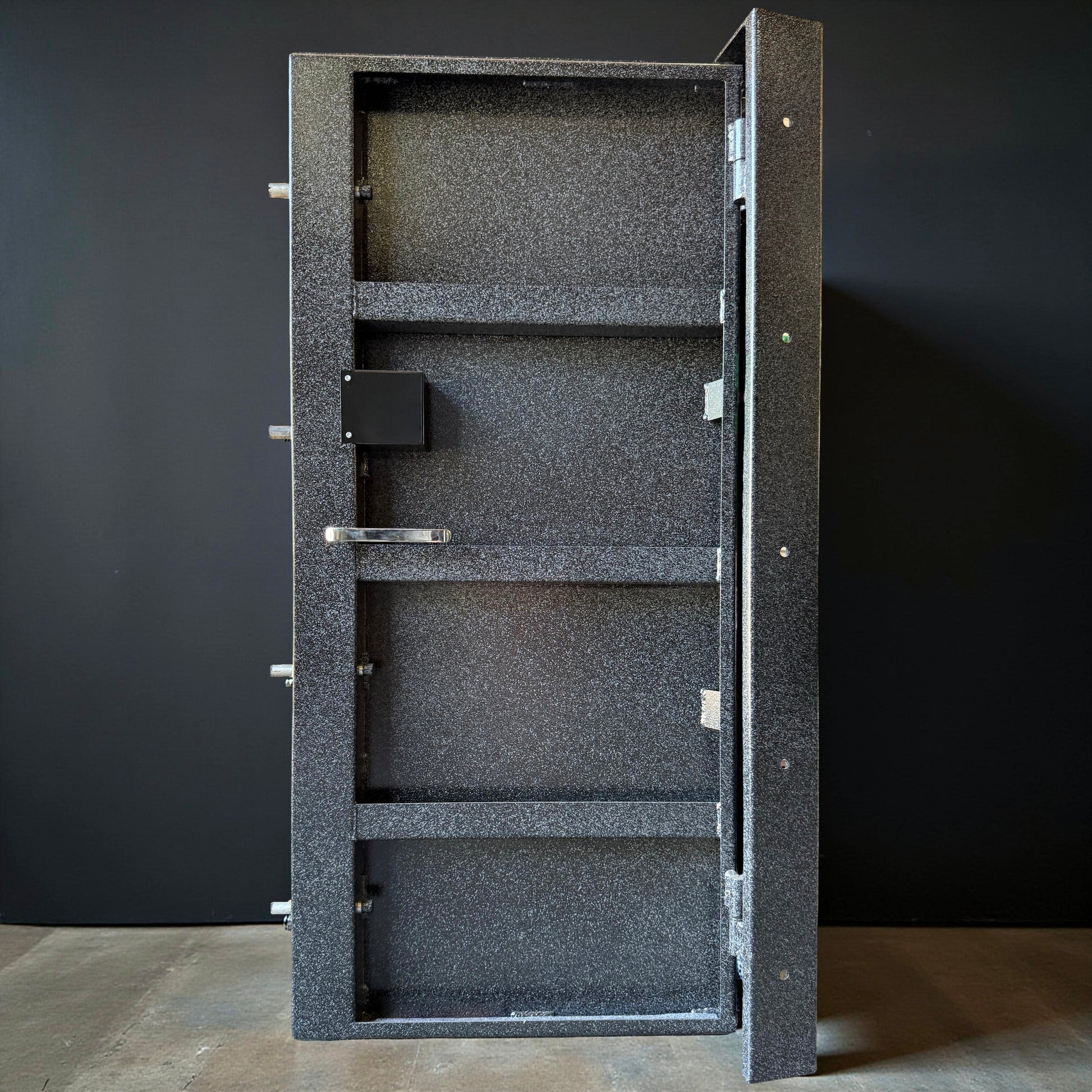 back of vault door with black background