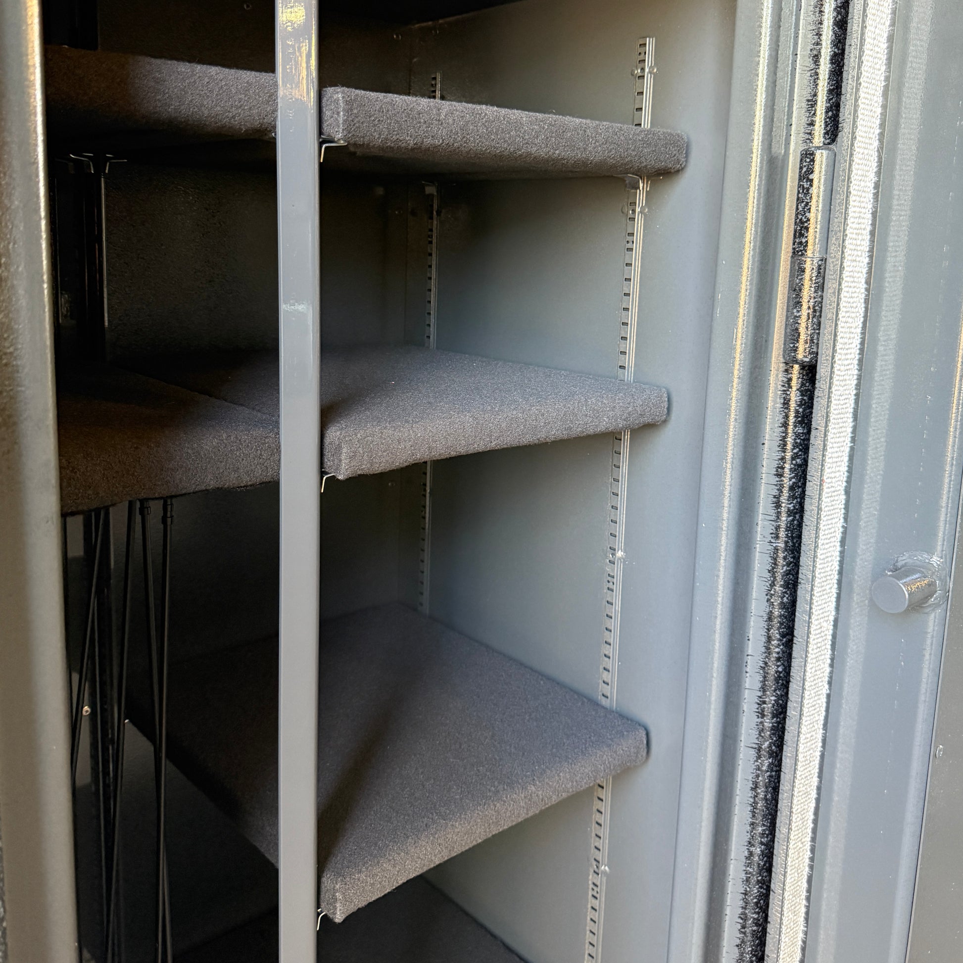 Metal shelving inside a gun safe