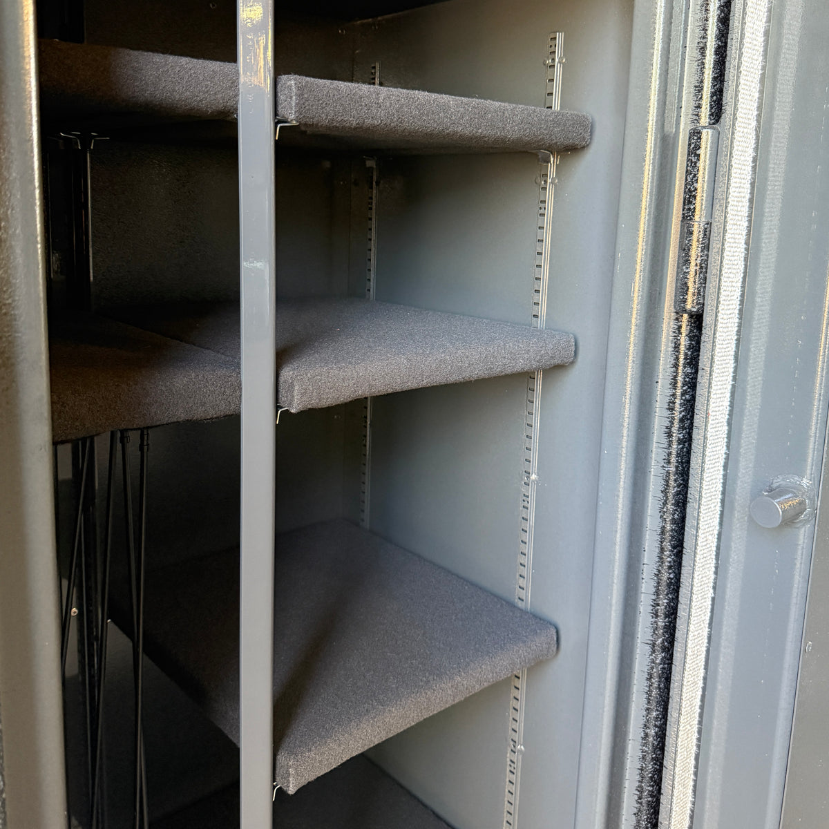 Metal shelving inside a gun safe