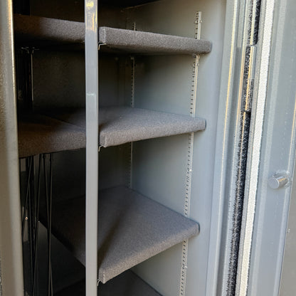 Metal shelving inside a gun safe