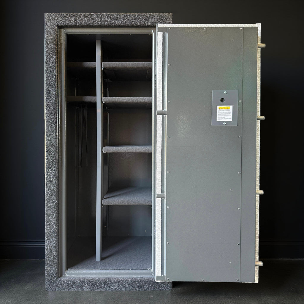 Large metal gun safe with open door on a dark background