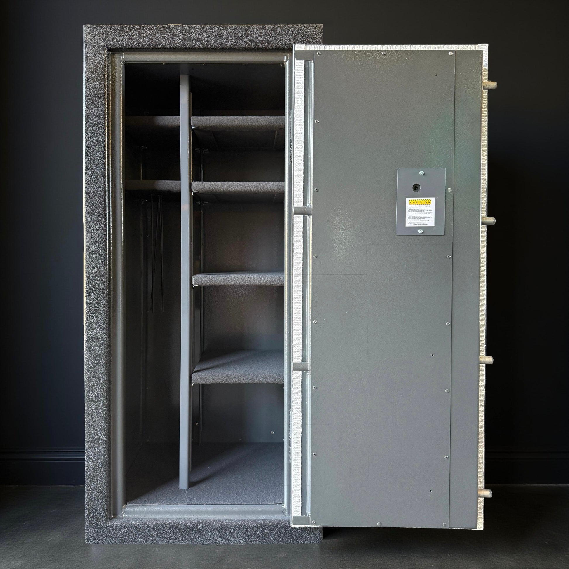 Large metal gun safe with open door on a dark background