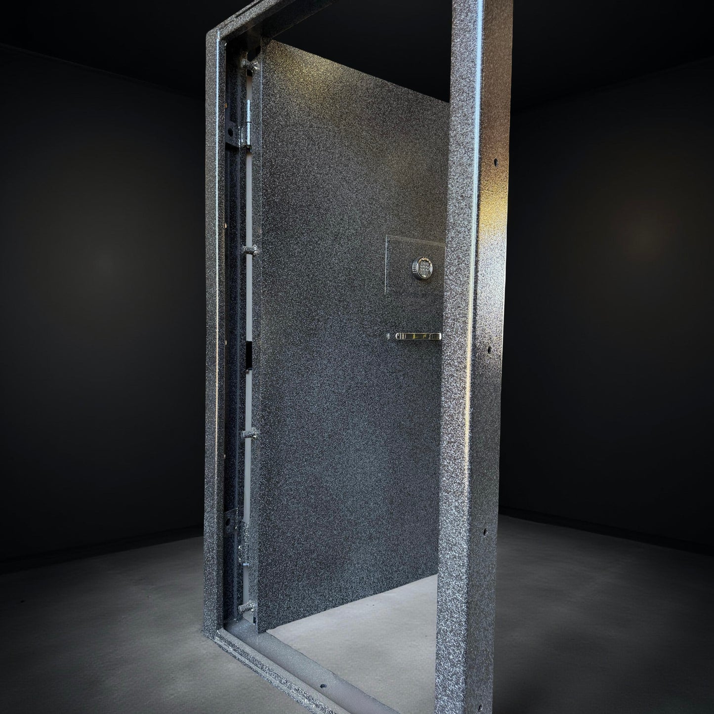 front of vault door on black background