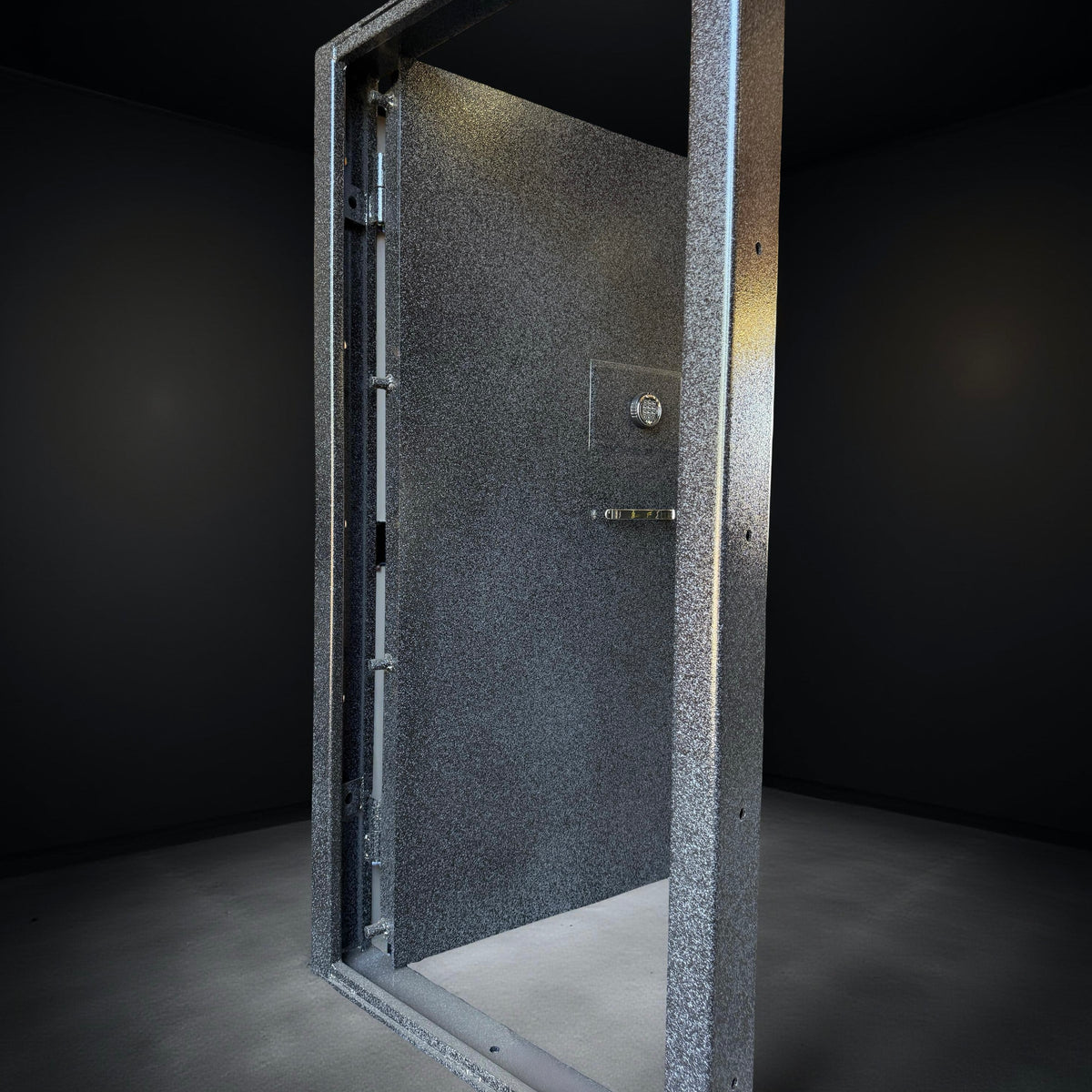 front of vault door on black background