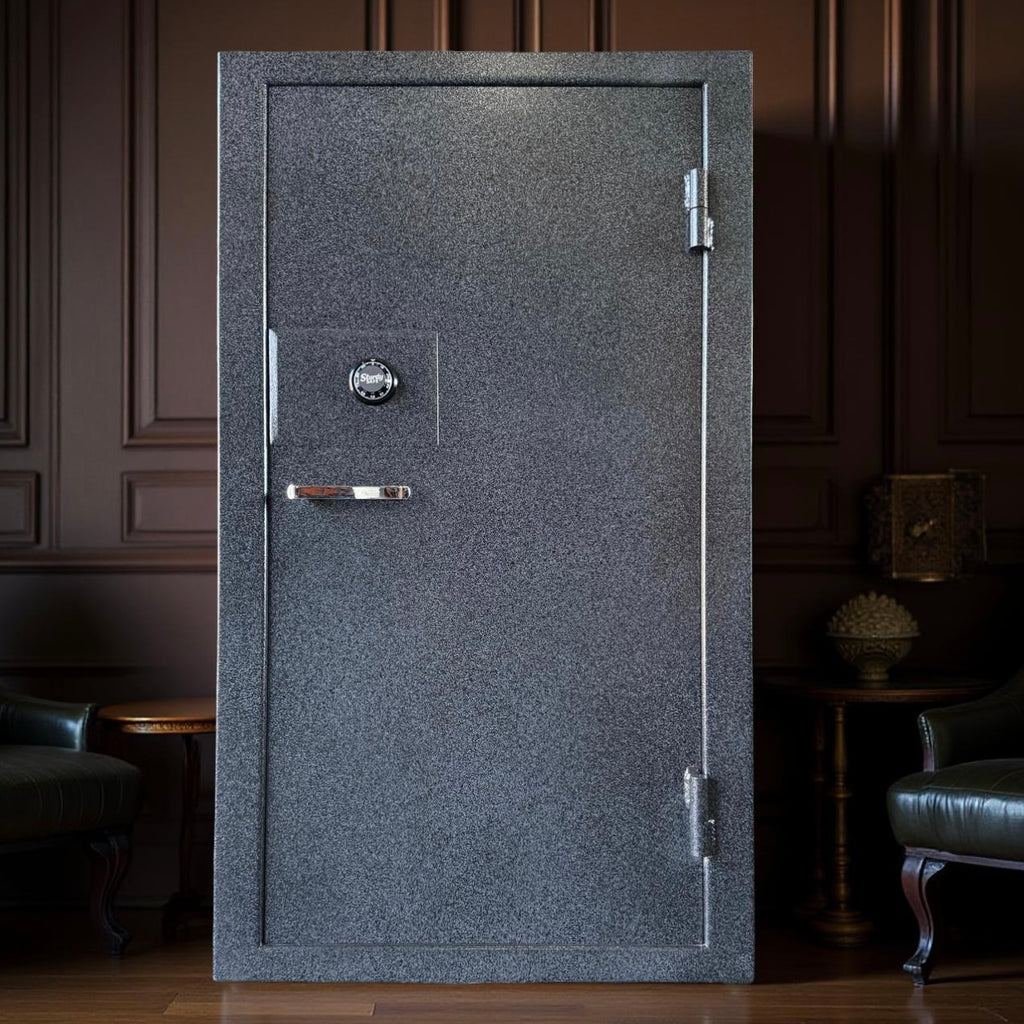 Gray gun safe with a silver handle in a dimly lit room.
