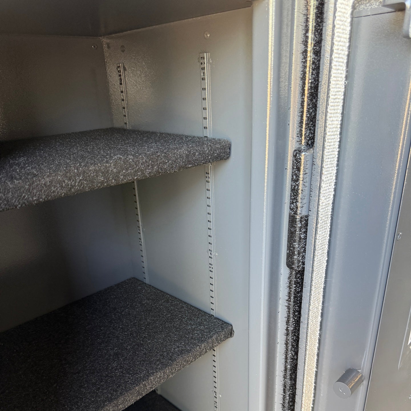 inside of gun safe showing shelving