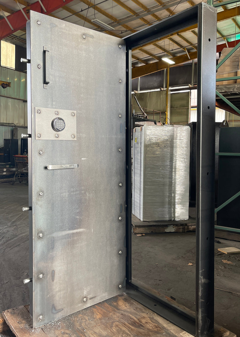 Metal vault door  in an industrial setting