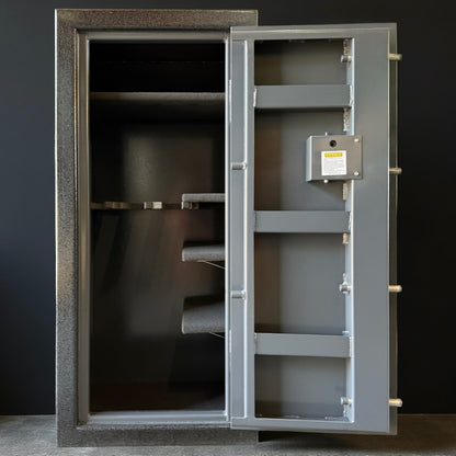 Open gray gun safe with visible interior shelves against a dark background