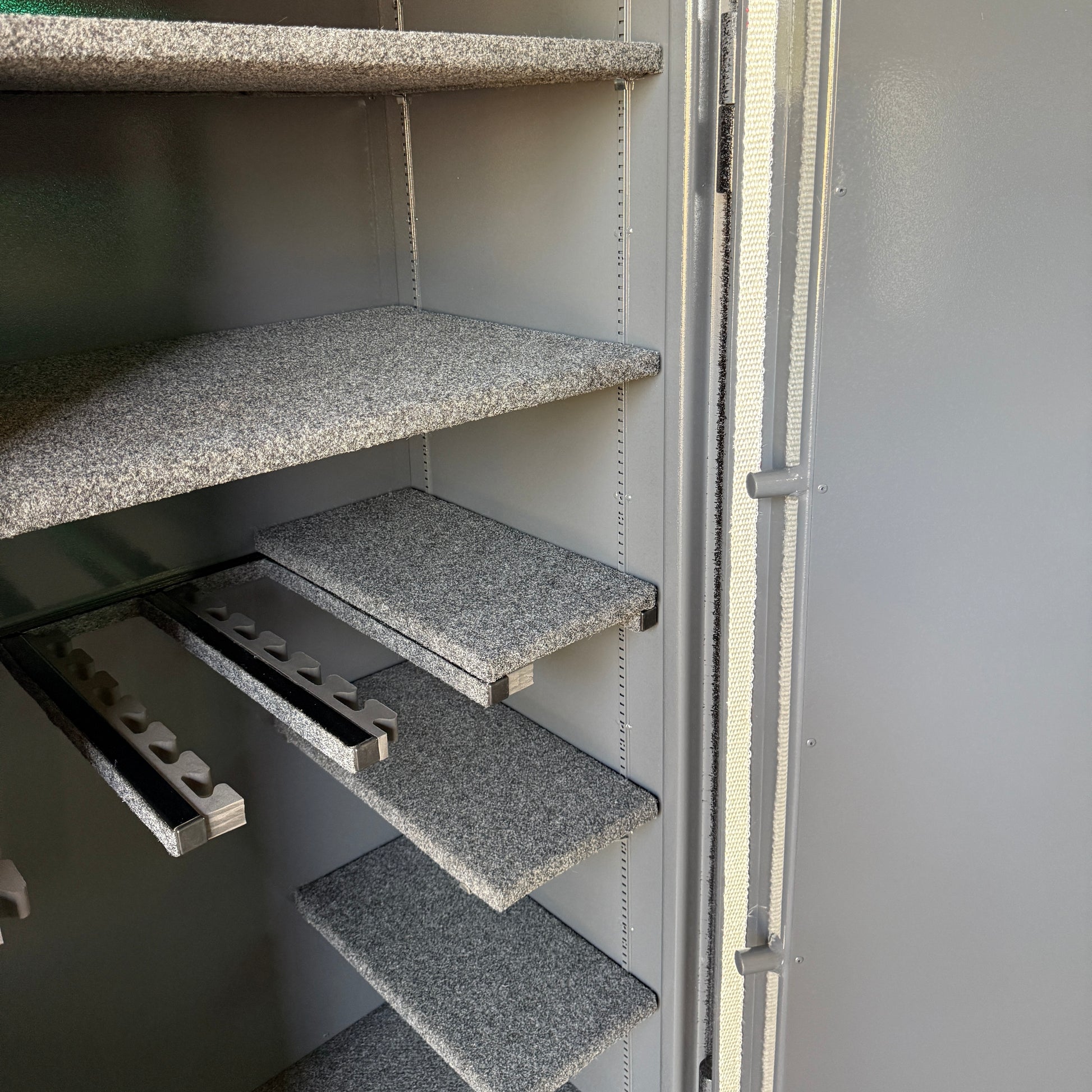 gun safe interior with gray shelves 