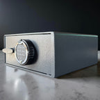pistol safe box with digital keypad on a reflective surface