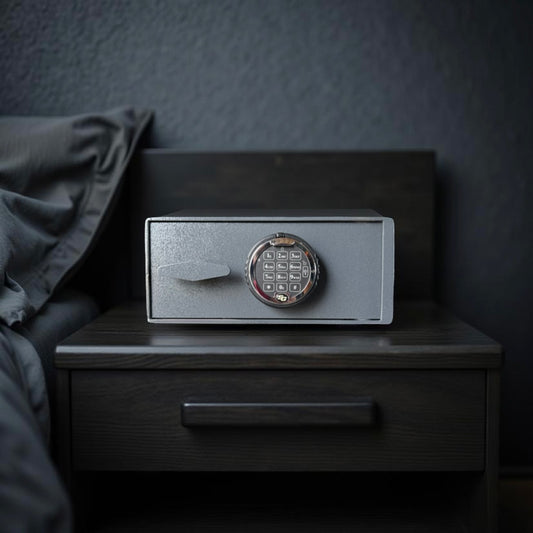 pistol safe box on a wooden nightstand against a dark wall.