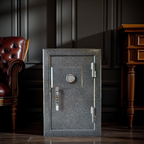 Small Gray gun safe in a room with dark walls and wooden furniture