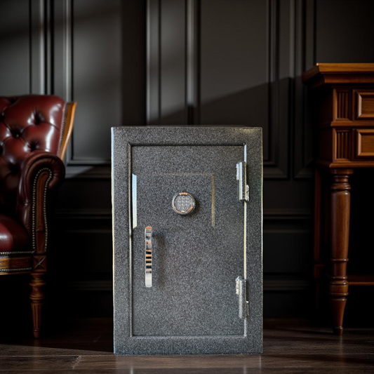 Small Gray gun safe in a room with dark walls and wooden furniture